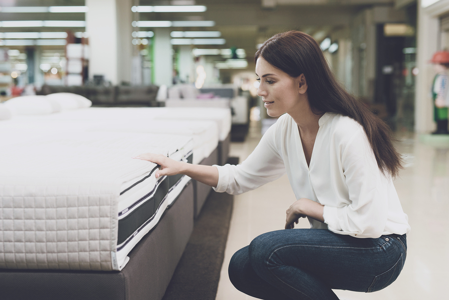 Bigstock a woman chooses a mattress in 207114250