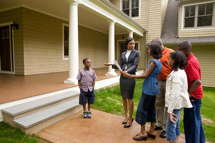 Family working with realtor
